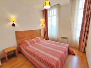 Posteľ alebo postele v izbe v ubytovaní Evasion, T3, centre Luchon, wifi, casier à skis, ascenseur, 6 personnes