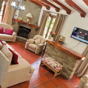 a living room with a couch and a fireplace at Ruca Quimei Malek in San Carlos de Bariloche