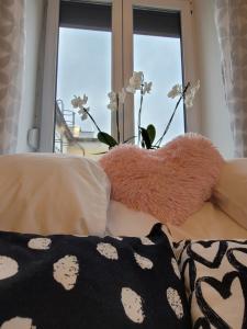 Posteľ alebo postele v izbe v ubytovaní Rosé Apartment