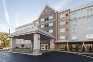 a front view of a hotel with a building at Country Inn & Suites Buffalo South I-90, NY in West Seneca