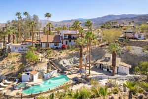 an aerial view of a resort with palm trees at Television Host and Designer Bobby Berk Invites You To His Desert Oasis in Palm Desert