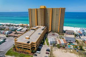 an aerial view of a large building next to the beach at Treasure Island 707 - Gulf front, sunset views, heated resort pool & hot tub! in Panama City Beach