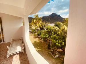 a room with a balcony with a view of a mountain at El Paraiso in La Gaulette