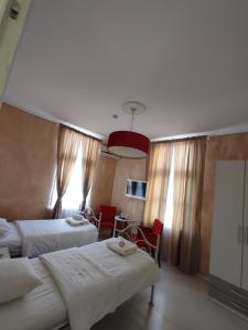 Postel nebo postele na pokoji v ubytování Citalna Rooms