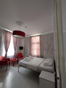Postel nebo postele na pokoji v ubytování Citalna Rooms