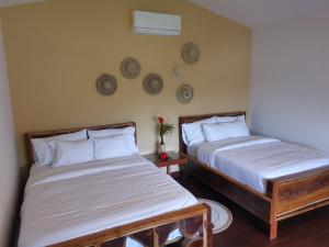 Vuode tai vuoteita majoituspaikassa Gatun Lake Lodge Hotel