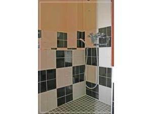 a bathroom with a shower with black and white tiles at Hostel Zen - Vacation STAY 91859v in Yokohama