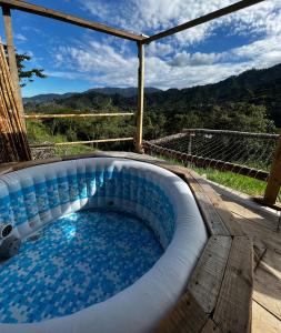 a swimming pool with a view of the mountains at Finca Ecoparaiso in Ibagué