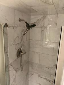 a shower with a glass door with a bird on it at The Pioneer Studio at 1400K in Anchorage