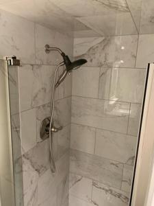 a shower with a glass door with a bird on it at The Pioneer Studio at 1400K in Anchorage +22 photos