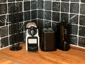 a coffee maker and a coffeemaker on a counter at Private room in heart of Oslo Grunerløkka in Oslo