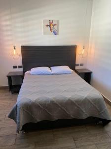 A bed or beds in a room at Quinta del sol