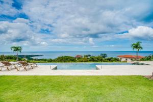 a pool with a view of the ocean at La Vista 2 - Diriá Tamarindo in Tamarindo