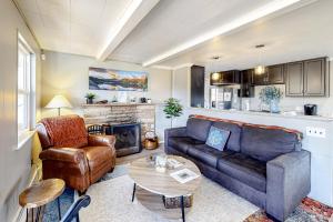 a living room with a couch and a table at Fairways & 14ers in Estes Park