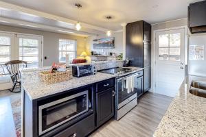a kitchen with black appliances and a counter top at Fairways & 14ers in Estes Park