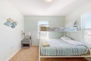 a bedroom with a bunk bed in a room at Sun & Sea in Gulf Shores +19 photos