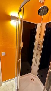 a bathroom with a shower with a mirror at smart&beautiful HOSTEL in Nordkirchen