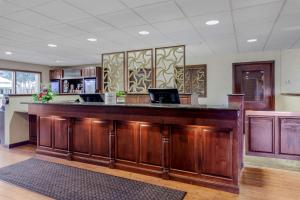 a large wooden bar in a room with a counter at Best Western Plus Dubuque Hotel and Conference Center in Dubuque