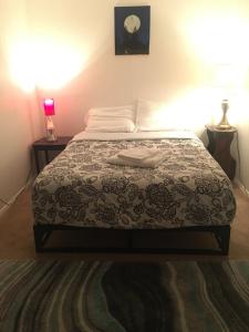 Postel nebo postele na pokoji v ubytování Greenwood Cottage