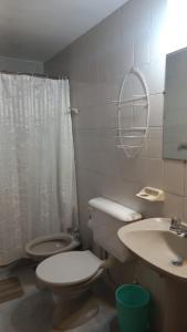 a bathroom with a toilet and a sink at casa de mar in Las Grutas