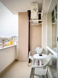A balcony or terrace at Art Apartment for 4 People Free Parking & Wifi