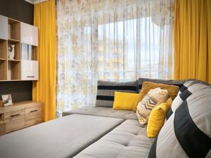 A bed or beds in a room at Art Apartment for 4 People Free Parking & Wifi