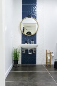 a bathroom with a sink and a mirror at Lugar do Ourives Boutique Hotel in Senhora das Febres