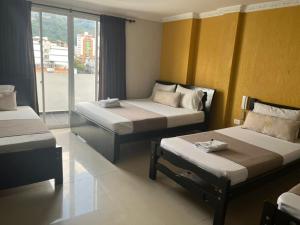 Uma cama ou camas num quarto em Hotel Chico Real