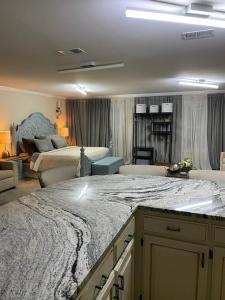 a large room with two beds and a living room at Hermosa Flor apartment( Duplex). in Pensacola +46 photos