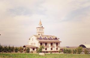 an old building with a tower on top of it at Spa Complejo Rural Las Abiertas in San Bartolomé de las Abiertas