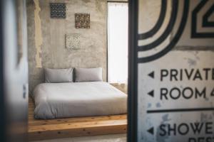 Postel nebo postele na pokoji v ubytování Yanbaru Hostel