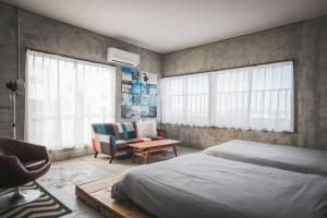 Postel nebo postele na pokoji v ubytování Yanbaru Hostel