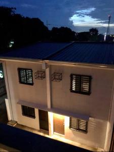 a building with solar panels on top of it at Sebastian’s Crib F in Dasmariñas