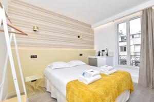 Ένα ή περισσότερα κρεβάτια σε δωμάτιο στο Résidence Beaugrenelle - Tour Eiffel 2