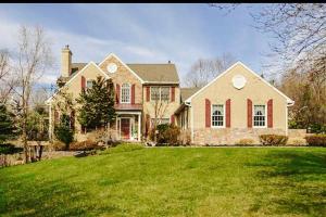 a large house with a green lawn in front of it at Luxury Vacation Estate in Pottstown