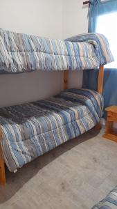 Una cama o camas cuchetas en una habitación  de Casa Villa Zorzal