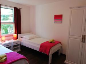 Ένα ή περισσότερα κρεβάτια σε δωμάτιο στο Apartments Rogac