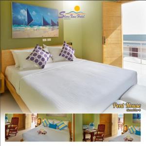 a bedroom with a large bed with a view of the ocean at Shore Time Hotel Boracay in Boracay