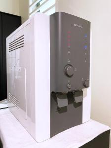 a microwave oven sitting on top of a table at D'concept Hotel Kulim in Kulim +46 photos