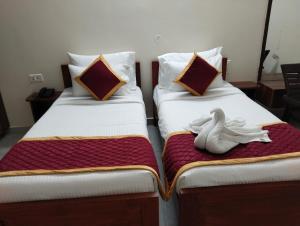 Ένα ή περισσότερα κρεβάτια σε δωμάτιο στο PPH Living KVR Residency