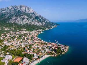an aerial view of a town next to the water at Apartments Goge - 90m from beach in Gradac