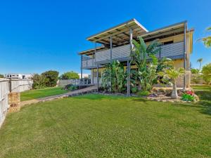 a house with a lawn in front of it at 242 Woongarra Scenic Drive in Bargara