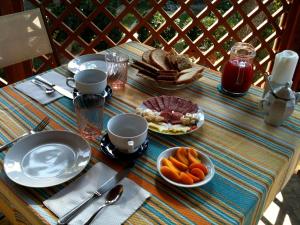 a table with plates of food on top at La Casa di Ulisse B&B in Quercianella