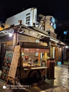 a food cart in front of a building at night at 一起-台南 雙人套房 in Tainan