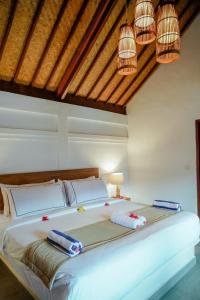 Cama ou camas em um quarto em Marygio Gili Resort