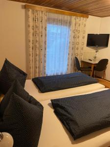 Postel nebo postele na pokoji v ubytování Haus St. Martin