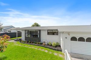 a home with a white house at Garden Grove Gem - Lake Taupō Holiday Home in Taupo