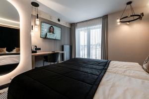Posteľ alebo postele v izbe v ubytovaní Aparthotel Zakopane