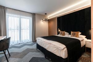 Posteľ alebo postele v izbe v ubytovaní Aparthotel Zakopane