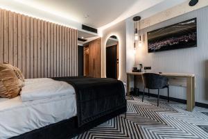 Posteľ alebo postele v izbe v ubytovaní Aparthotel Zakopane